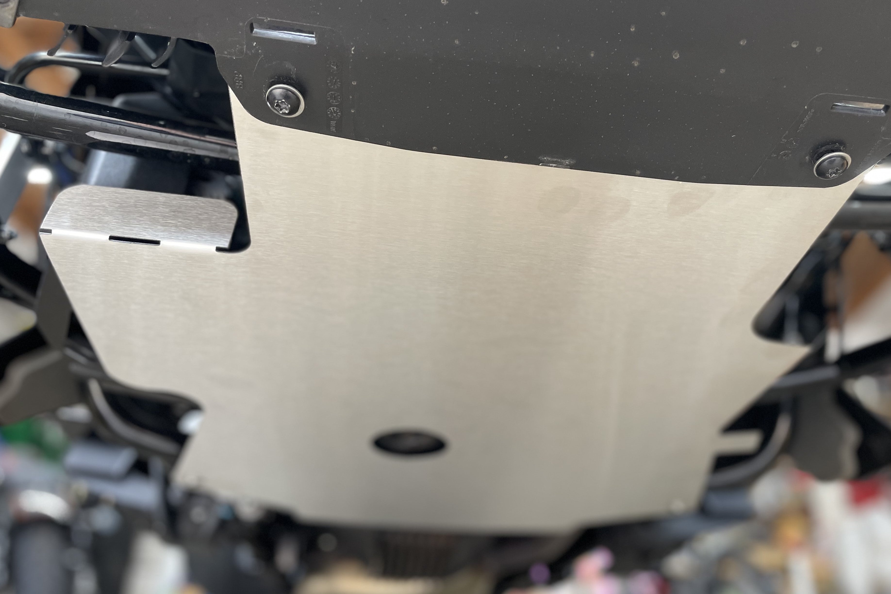Engine guard with integrated VSS stone guard and Rectifier cooler chan ...